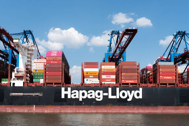 08-16-2020 Hamburg, Germany: Large container ship and container gantry cranes in port of Hamburg. AL DAHNA is a 400 meter long vessel operatred by Hapag-Lloyd.