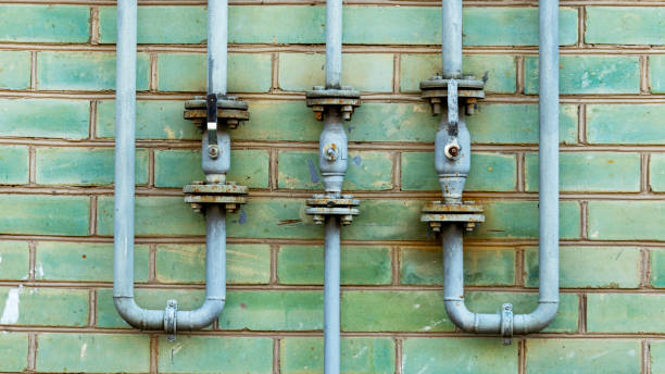 istock Pipeline with gas supply taps on a brick wall 1266775953