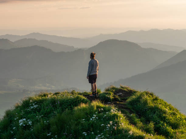 istock Man hikes in Switzerland and stops to look at view 1266778253