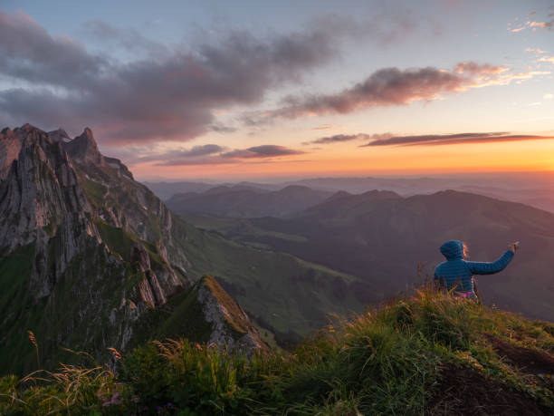 istock Hiker takes selfie on mountain top at sunset 1266778318