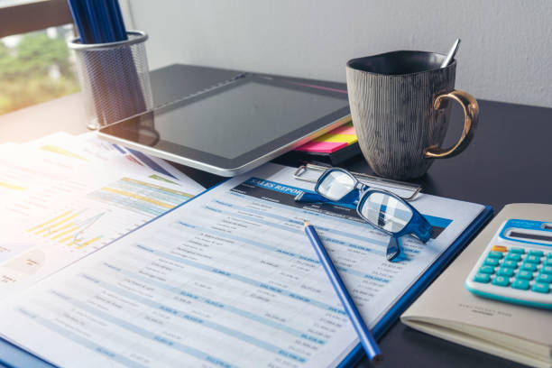 istock Excel graph with Spreadsheet Document showing Information Financial Startup Concept. Financial Planning making Accounting Database Report. Graphs and chart on screen with stationery set business stuff 1266778764