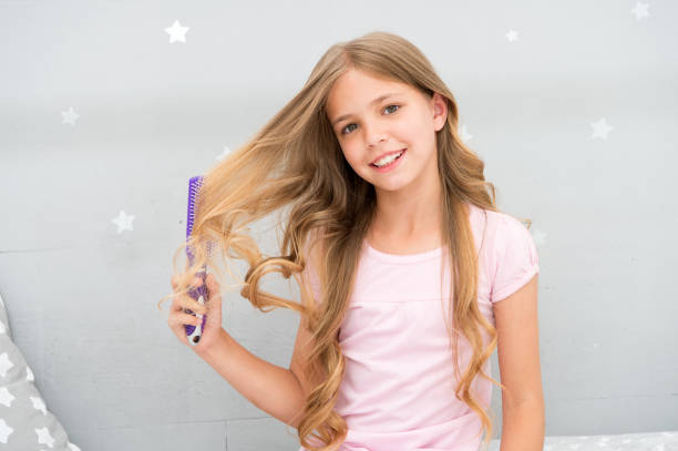 Girl Combing Hair Stock Photos, Pictures & Royalty-Free Images - iStock