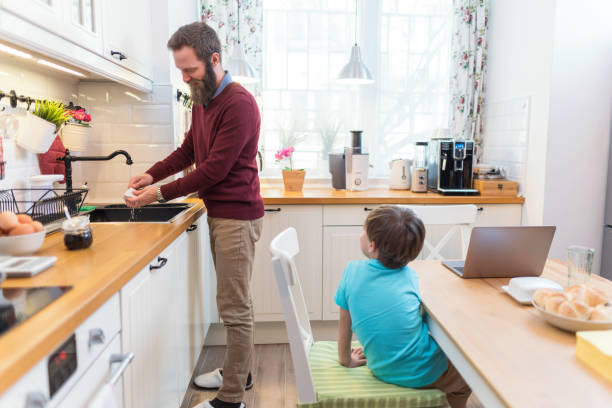 istock Father and son staying at home together 1266780817