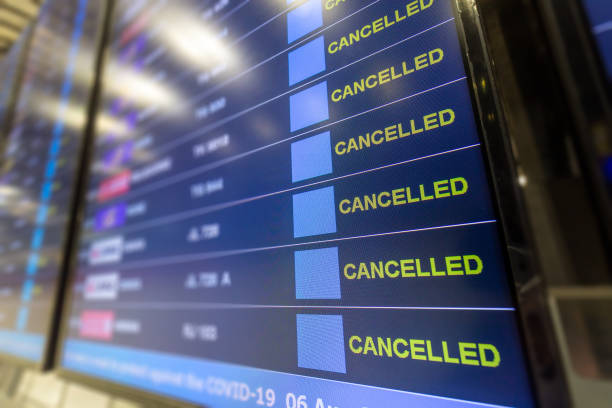 Cancelled all flight on flight information board at airport effect from COVID-19 pandemic Cancelled all flight on flight information board at airport effect from COVID-19 pandemic situation and lockdown policy commercial airplane stock pictures, royalty-free photos & images
