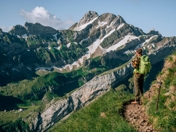 istock Man hikes in the Swiss Alps 1266781132