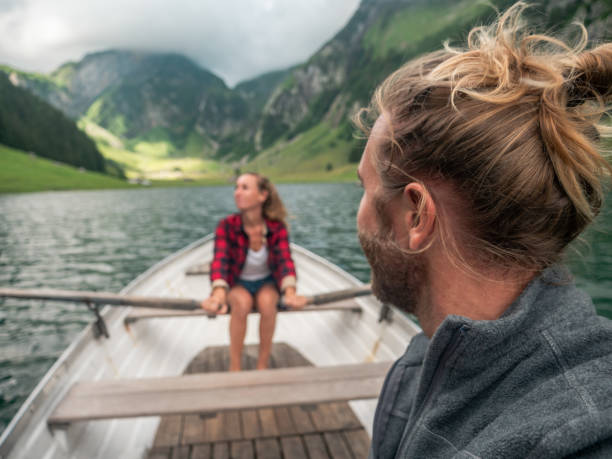 istock Couple relaxing on rowing boat, alpine lake 1266781158
