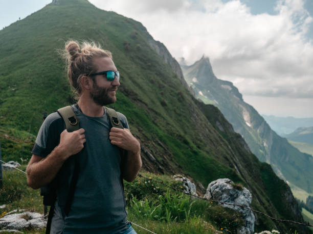 istock Man hikes in the Swiss Alps 1266781776