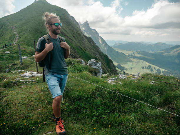 istock Man hikes in the Swiss Alps 1266781791