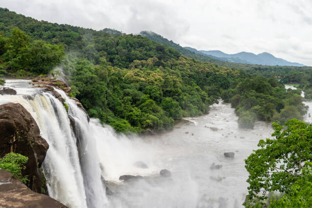 istock Beautiful nature view during Mansoon time with full filled water fall and green forest from the famous tourist place in Kerala, India called Athirappalli, Vaazhachaal 1266782192