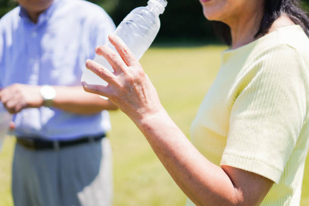 istock Old couple drinking water outside 1266782398