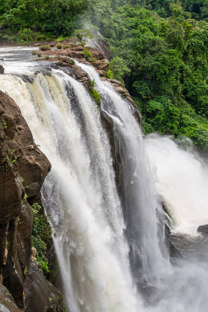 istock Beautiful nature view during Mansoon time with full filled water fall and green forest from the famous tourist place in Kerala, India called Athirappalli, Vaazhachaal 1266783882