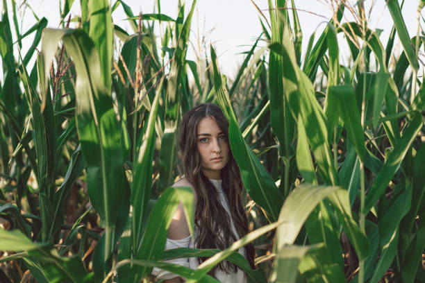 istock Young girl in the field corn. Summer time. Unity with nature. 1266784074
