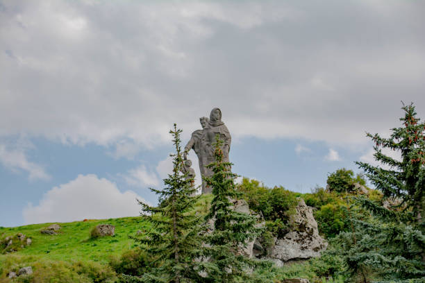 istock Big statue at the peak of the mountain 1266784090