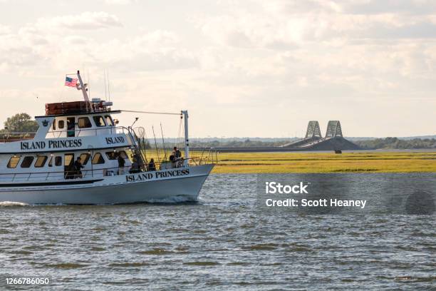 A Public Fishing Boat From The Laura Lee Captree Fleet Setting Sail With  The Robert Moses Causeway Bridge In The Background Stock Photo - Download  Image Now - iStock