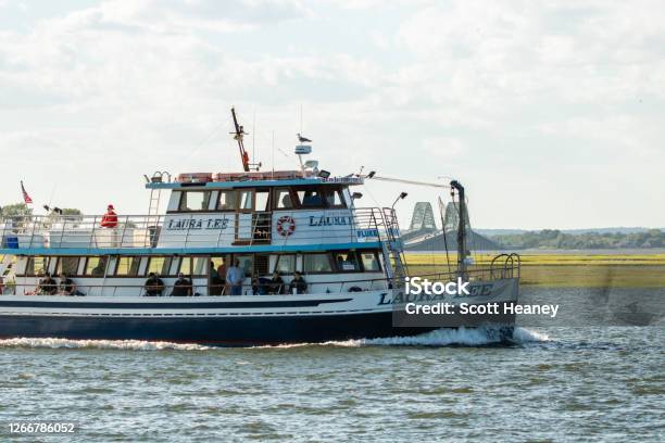 A Public Fishing Boat From The Laura Lee Captree Fleet Setting Sail With  The Robert Moses Causeway Bridge In The Background Stock Photo - Download  Image Now - iStock