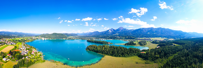 Faakersee in Carinthia. Aerial view to the beautiful lake and the Mittagskogel mountain in the south of Austria.