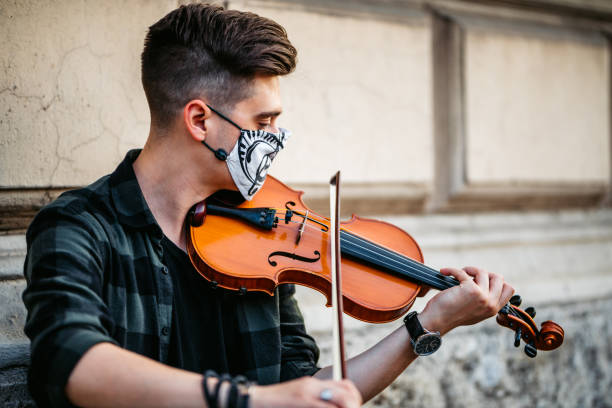 istock Street violin player 1266789790