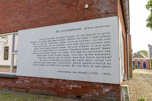 Winsum (Gr), the Netherlands - 15 Aug, 2020: Famous old childeren poem “De pruimeboom” on wall of a childeren book museum in Winsum