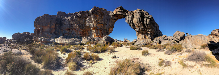 Wide Panoramic view of the Wolfberg Arch with people, Southern Cederberg Wildernis Area, Western Cape, South Africa