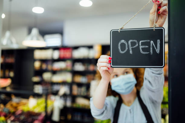 istock Young waitress opening a fruit and vegetable market 1266797271