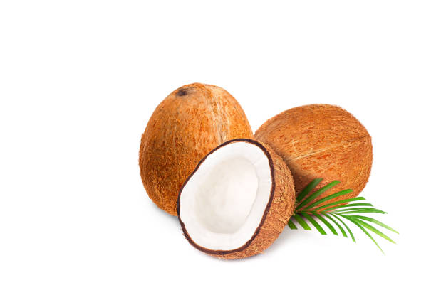 istock Coconut with half. Fresh raw coconut with palm leaves isolated on white background. 1266797809