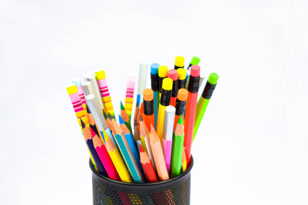 istock A black colored plastic pencil holder containing many different colored wood pencil crayons 1266799551