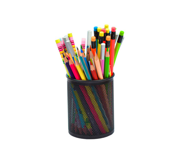 istock Black colored plastic pencil holder containing many different colored wood pencil crayons 1266799689