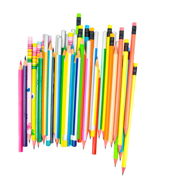 istock Some different colored wood pencil crayons scatter across a white paper background 1266800613