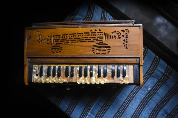 Photo of a traditional harmonium indian music instrument kept on a table