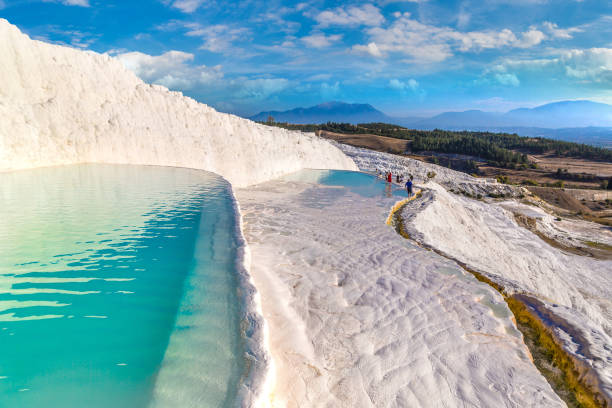istock Travertine pools and terraces in Pamukkale, Turkey 1266802818