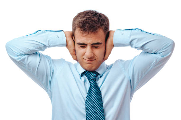 istock Businessman holding his hands in his ears 1266804315