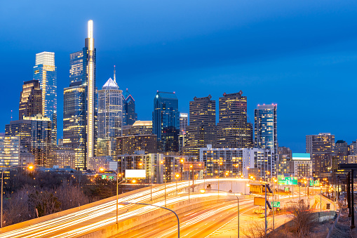 Cityscape of Philadelphia skyscraper Skylines building twilight dusk sunset with highway urban road transportation in Philly city downtown of Philadelphia in PA USA. Cityscape Urban lifstyle concept.