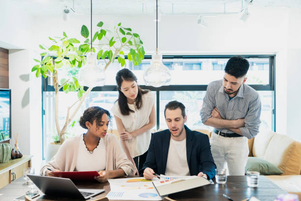 istock Businessmen of various races meeting 1266804591
