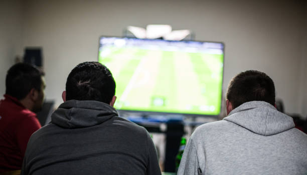 istock Friends enjoy beer and video games 1266807079