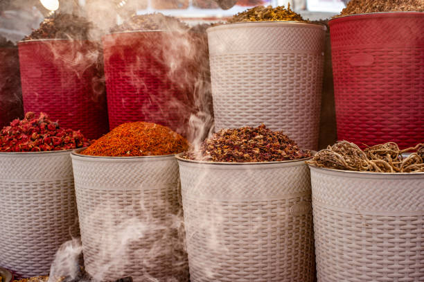istock Incense burning alongside coloured spices for sale in Dubai Creek Souk, UAE. 1266807274