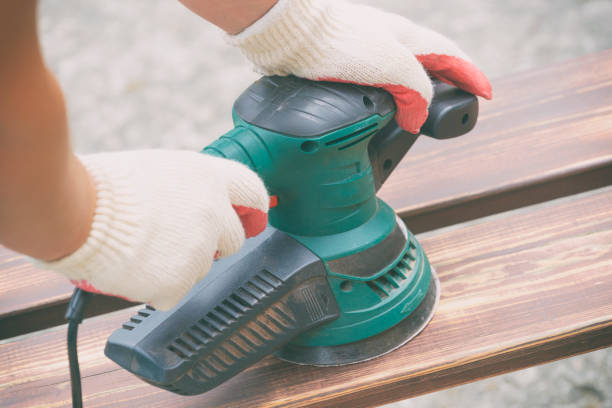 istock Sanding a wood with orbital sander 1266807745