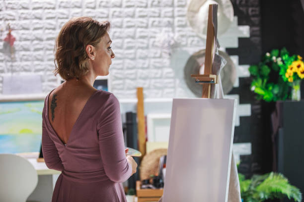 istock Creative woman getting her inspiration before she starts painting 1266809737
