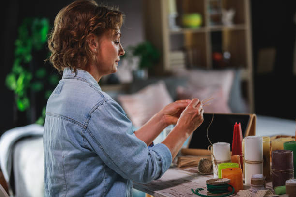 istock Putting together a candle decoration 1266810605