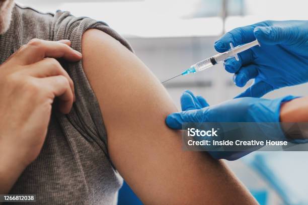 Vaccination Of Senior Person In Hospital Stock Photo - Download Image Now - Vaccination, Injecting, Coronavirus
