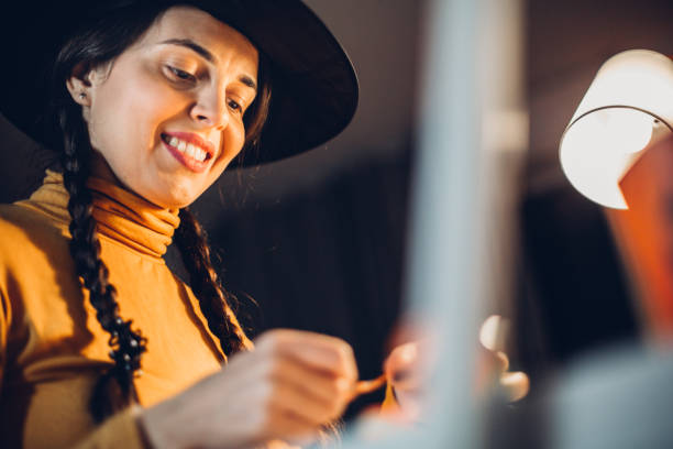 istock Young woman makes Halloween garland 1266812063