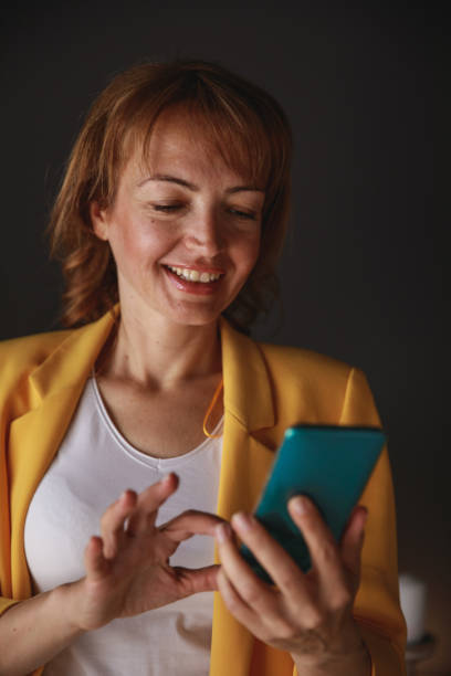 istock A moment in the office to check her notifications 1266813121