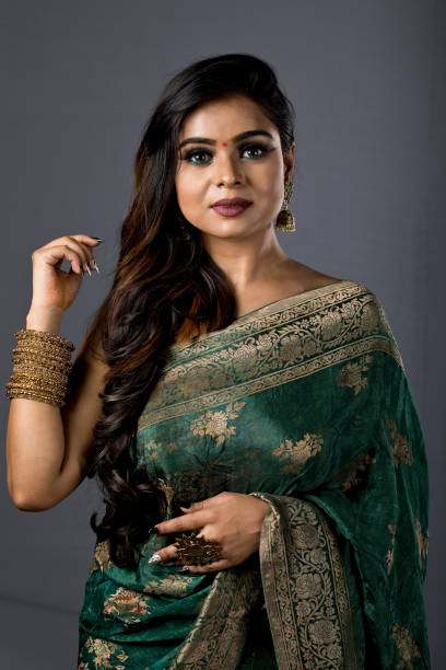 istock Beautiful Indian woman in sari 1266816200