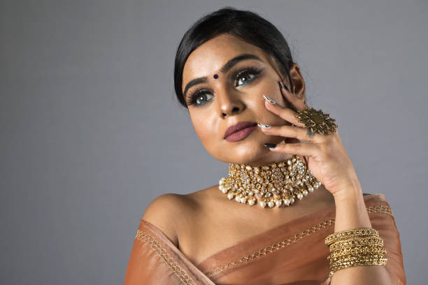 istock Beautiful Indian woman in sari 1266818106