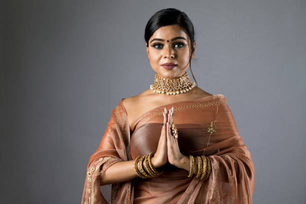 istock Indian woman greeting 1266818165
