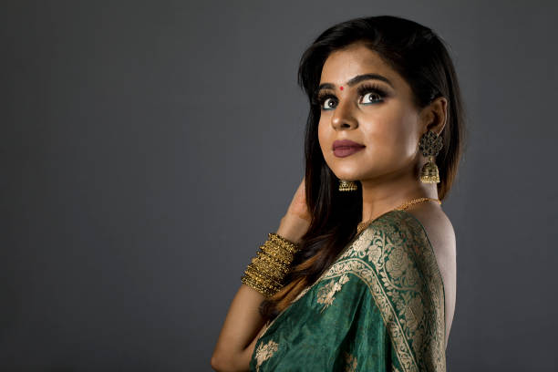 istock Beautiful Indian woman in sari 1266819035