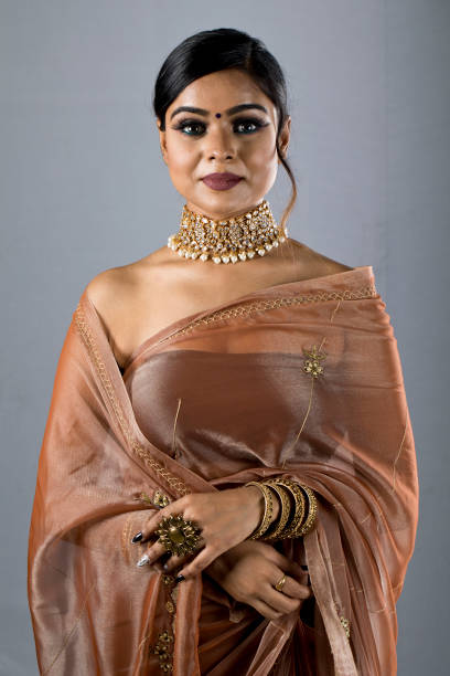 istock Beautiful Indian woman in sari 1266819056