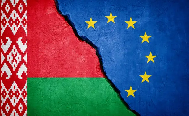 Belarus and European Union conflict. Flags on broken wall. Illustration.