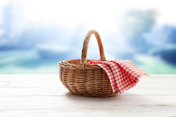 istock empty basket with red napkin picnic on table place 1266820579
