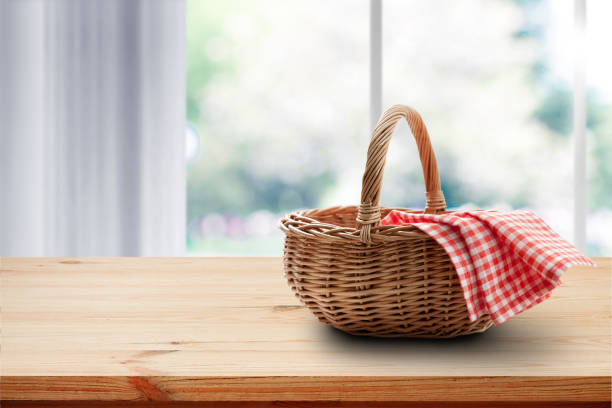 istock Empty basket with red napkin picnic on table place. Spring background. 1266820581