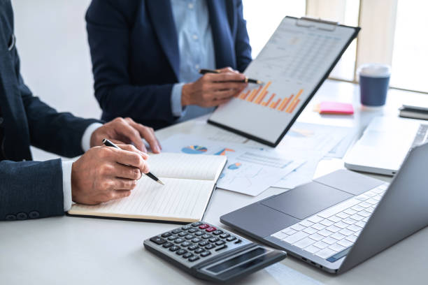 istock Business team meeting to conference, collaboration discussing working analyzing with financial data and marketing business strategy project, presentation and brainstorming to making profit of company 1266820600